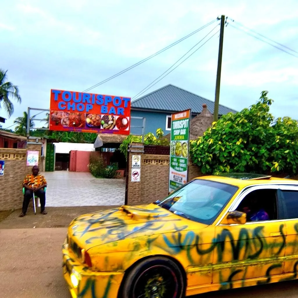 Tourispot Chop Bar entrance sign by the road